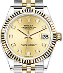 Midsize Datejust 31mm in Steel with Yellow Gold Fluted Bezel on Jubilee Braclet with Champagne Diamond Dial
