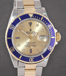 Submariner 40mm in Steel and Yellow Gold Blue Bezel on Oyster Bracelet with Champagne Serti Diamond Dial