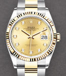 Datejust 36mm in Steel with Yellow Gold Fluted Bezel on Oyster Bracelet with Champagne Diamond Dial