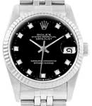 Mid Size Datejust 31mm in Steel with White Gold Fluted Bezel on Jubilee Bracelet with Black Diamond Dial