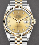 Datejust 36mm in Steel with Yellow Gold Fluted Bezel on Jubilee Bracelet with Champagne Diamond Dial