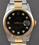 Datejust 36mm in Steel with Yellow Gold Smooth Bezel on Oyster Bracelet with Black Diamond Dial