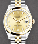 Datejust 31mm in Steel with Yellow Gold Domed Bezel on Jubilee Bracelet with Champagne Diamond Dial