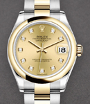 Datejust 31mm in Steel with Yellow Gold Domed Bezel on Oyster Bracelet with Champagne Diamond Dial