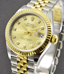 Datejust Ladies 28mm in Steel with Yellow Gold Fluted Bezel on Jubilee Bracelet with Champagne Diamond Dial