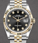 Datejust 36mm in Steel with Yellow Gold Fluted Bezel on Jubilee Bracelet with Black Diamond Dial