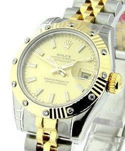 Datejust Lady's in Steel with Yellow Gold Fluted 12 Diamond Bezel on Jubilee Bracelet with Champagne Stick Dial