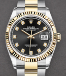 36mm Datejust in Steel with Yellow Gold Fluted Bezel on Oyster Bracelet with Black Diamond Dial